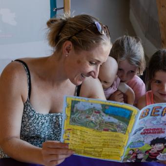 Family reading Beano Eden comic